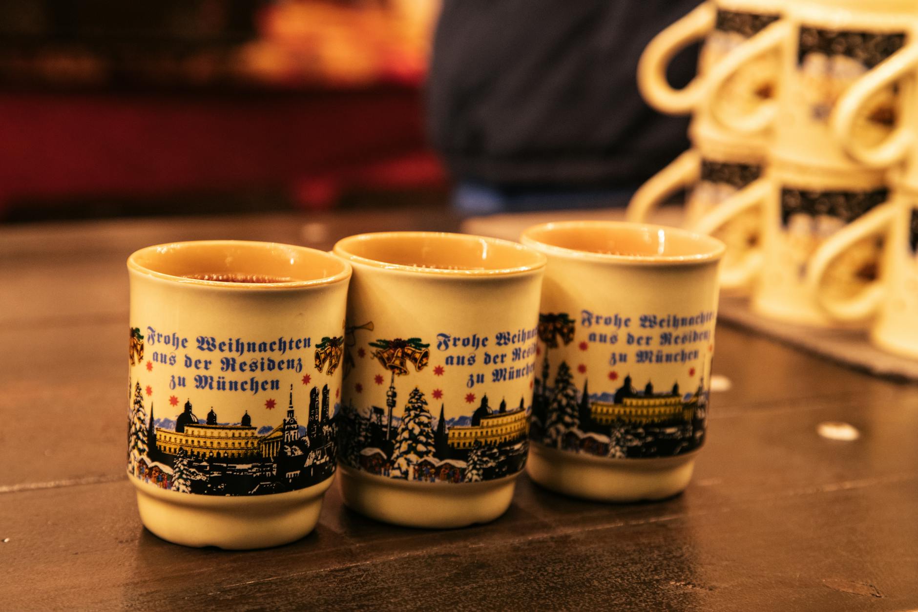 Festive holiday mugs at the Munich Christmas market, perfect for warm beverages.